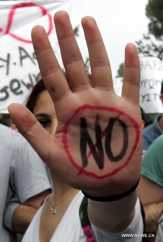 Ordinary Cypriots step in the streets to protest against the massive 