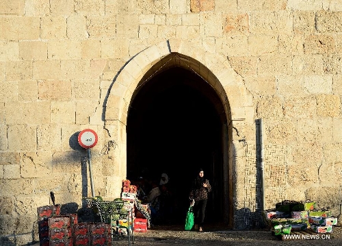 This photo taken on July 3, 2013 shows the Herod's Gate or Flower Gate of Jerusalem's Old City. Old City of Jerusalem and its Walls were recorded on the United Nations Educational, Scientific and Cultural Organization's World Heritage list in 1982. (Xinhua/ Yin Dongxun)
