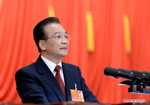 Chinese Premier Wen Jiabao delivers the government work report during the opening meeting of the first session of the 12th National People's Congress (NPC) at the Great Hall of the People in Beijing, capital of China, March 5, 2013. (Xinhua/Liu Jiansheng)