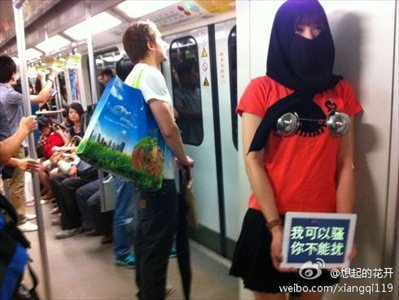 A protestor carries a sign that reads 