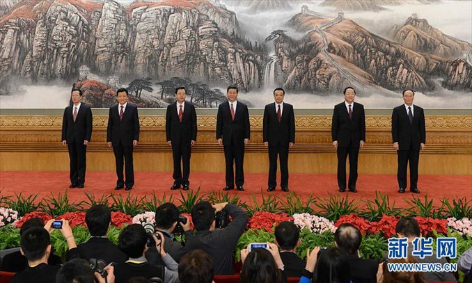 General Secretary of the Central Committee of the Communist Party of China (CPC) Xi Jinping (C) and the other newly-elected members of the Standing Committee of the 18th CPC Central Committee Political Bureau Li Keqiang (3rd R), Zhang Dejiang (3rd L), Yu Zhengsheng (2nd R), Liu Yunshan (2nd L), Wang Qishan (1st R), Zhang Gaoli (1st L) meet with journalists at the Great Hall of the People in Beijing, capital of China, Nov. 15, 2012. Photo: Xinhua