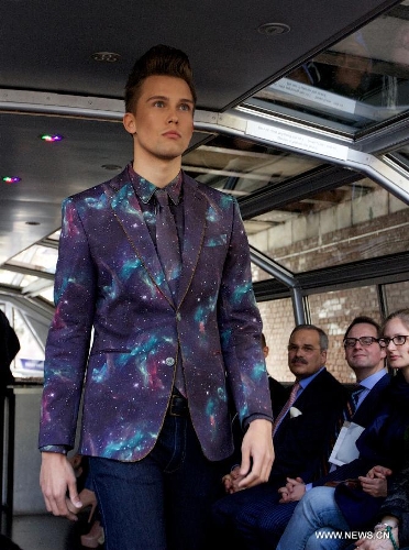 A model presents a creation on a canal boat in Amsterdam, the Netherlands, on May 22, 2013. The event