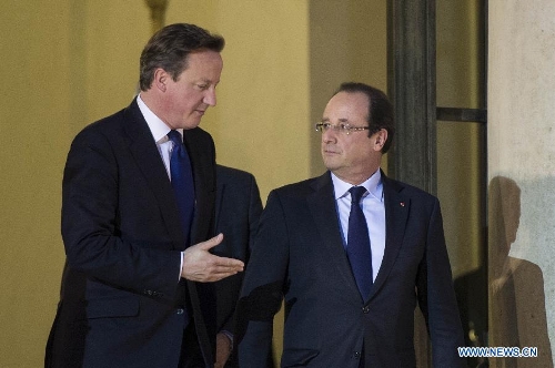French President Francois Hollande (R) and British Prime Minister David Cameron leave the Elysee Palace in Paris, France, May 22, 2013. French President Francois Hollande and British Prime Minister David Cameron on Wednesday condemned the assassination of a British soldier in the suburbs of London after their meeting in Paris. (Xinhua/Etienne Laurent)