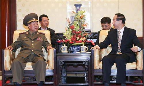 Wang Jiarui (R), vice-chairman of the National Committee of the Chinese People's Political Consultative Conference and head of the International Department of the Communist Party of China Central Committee, meets with Choe Ryong Hae, special envoy of the Democratic People's Republic of Korea (DPRK) top leader Kim Jong Un, and a member of the Presidium of the Political Bureau of the Central Committee of the Workers' Party of Korea, in Beijing, capital of China, May 22, 2013. Photo: Xinhua