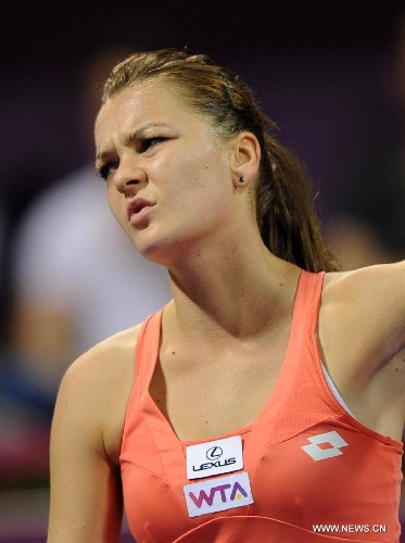 Agnieszka Radwanska of Poland reacts during the women's semifinal against Victoria Azarenka of Belarus at the Qatar Open tennis tournament in Doha, capital of Qatar, Feb. 16, 2013. Radwanska lost 0-2. (Xinhua/Chen Shaojin) 