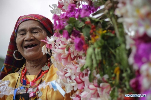 A woman participates in the procession of 