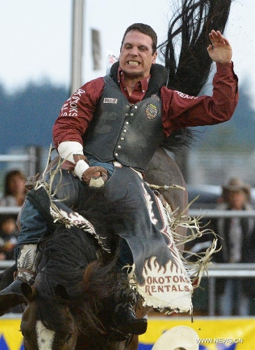 Dusty LaValley of Canada competes in Bareback Riding category at the annual Cloverdale Professional Rodeo 2013 in Cloverdale, BC, Canada, May 17, 2013. In 1984 the Cloverdale Rodeo was voted the Number One Performance Rodeo in North America by the Professional Rodeo Cowboy's Association. Today the Cloverdale Rodeo & Exhibition is the second largest community rodeo in Canada, attracting competitors and spectators worldwide. (Xinhua/Sergei Bachlakov) 