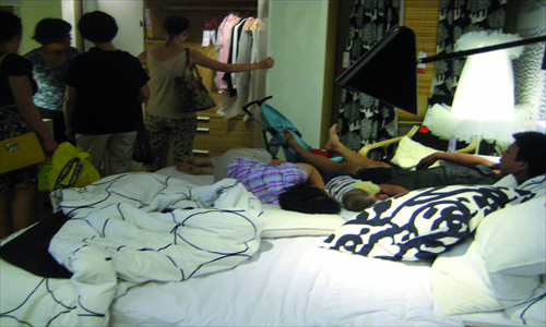 Customers chill in various parts of IKEA in Beijing, sometimes for the whole day. This is a common site in Chinese IKEA stores, but less common outside of China, making it an interesting phenomenon that many talk about. Photos: Yin Lu/GT