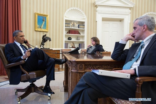 In this handout photo, U.S. President Barack Obama (L) talks on the phone with FBI Director Robert Mueller to receive an update on the explosions that occurred in Boston, in the Oval Office of the White House in Washington D.C., capital of the United States, April 15, 2013. Seated with the President are Lisa Monaco, Assistant to the President for Homeland Security and Counterterrorism, and Chief of Staff Denis McDonough. (Xinhua/the White House/Pete Souza) 