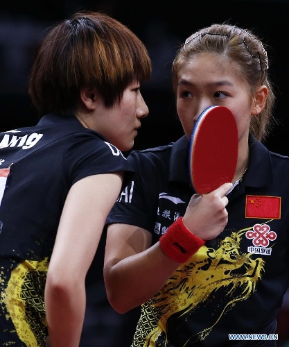 Ding Ning and Liu Shiwen(R) of China communicate during the semifinal of women's doubles against their teammates Chen Meng and Zhu Yuling at the 2013 World Table Tennis Championships in Paris, France on May 19, 2013. Ding Ning and Liu Shiwen won 4-3. (Xinhua/Wang Lili) 