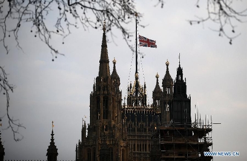 The Union Flag flies at half mast over the Houses of Parliament following the death of former British Prime Minister Baroness Margaret Thatcher in London, Britain, on April 8, 2013. It has been confirmed that Lady Thatcher died this morning following a stroke at the age of 87. (Xinhua/Wang Lili) 
