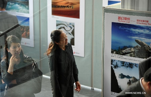  A woman views pictures at a photo exhibition named 