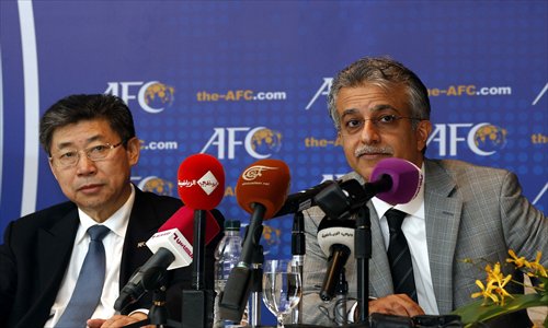 Sheikh Salman bin Ebrahim al-Khalifa (right), president of the Asian Football Confederation, and Zhang Jilong, former acting president of the Asian Football Confederation are seen at the press conference during the 2013 AFC Congress in Kuala Lumpur, Malaysia on Thursday. Photo: CFP