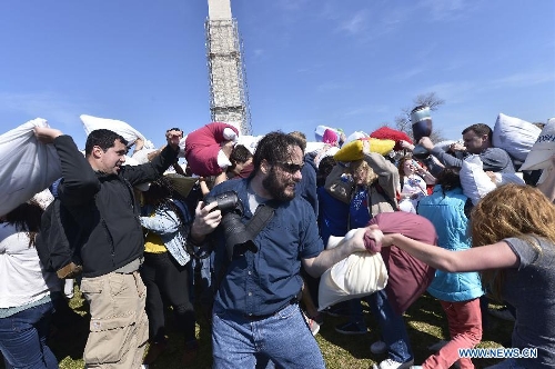 People participate in the pillow fight in Washington D.C., the United States, April 6, 2013. (Xinhua/Zhang Jun) 