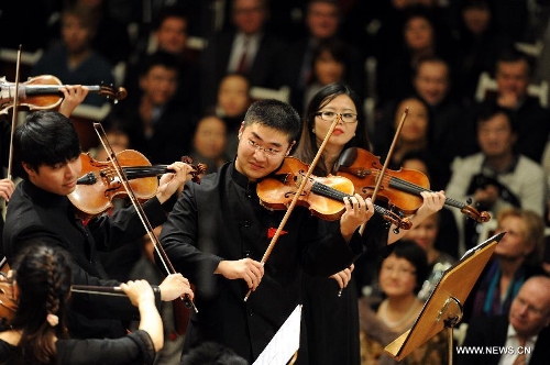 Members of the Zhejiang Symphony Orchestra give performance during the conclusion performance of the 2012 China Cultural Year in Germany, at the Concert Hall in Berlin, Germany, Jan. 13, 2013. (Xinhua/Wang Xiaochuan) 