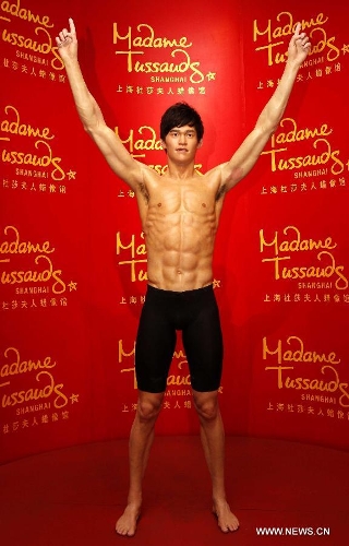 The waxwork of star swimmer Sun Yang is unveiled at Madame Tussauds Shanghai in east China's Shanghai Municipality, Feb. 4, 2012. Sun is the first Chinese male swimmer to win an Olympic gold. (Xinhua/Liu Ying) 