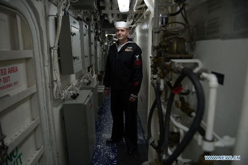 Fire Controlman 1st Class Gilbord is seen inside the U.S. Navy guided-missile cruiser USS Lake Champlain during a media presentation in North Vancouver, Canada, on April 27, 2013. Approximately 1,000 Canadian and American sailors are in Vancouver to meet the public and media to bring the Navy to the Canadians. (Xinhua/Sergei Bachlakov) 