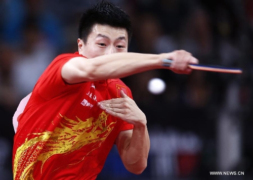Ma Long of China competes during men's singles round of 16 against Niwa Koki of Japan at the 2013 World Table Tennis Championships in Paris, France on May 18, 2013. Ma won 4-2. (Xinhua/Wang Lili) 