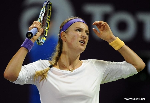 Victoria Azarenka of Belarus reacts during the women's semifinal against Agnieszka Radwanska of Poland at the Qatar Open tennis tournament in Doha, capital of Qatar, Feb. 16, 2013. Azarenka won 2-0. (Xinhua/Chen Shaojin) 