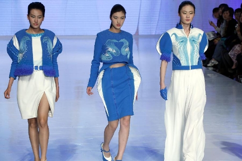 Model present creations designed by Wu Wei, a student of the School of Fashion of Wuhan Textile University, during a contest of New Designers Award in Beijing, capital of China, April 28, 2013. (Xinhua/Li Mingfang) 