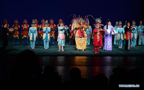 Artists answer the curtain call after performing Peking opera at the Lucent Danstheater in Hague, the Netherlands, May 21, 2013. Peking Opera Theater of Beijing started its European tour in Hague on Tuesday. It will also perform in Linz of Austria and Milan of Italy. (Xinhua/Jin Liangkuai) 