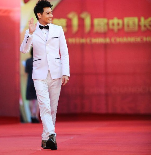 Actor Jimmy Lin walks on the red carpet during the closing ceremony of Changchun Film Festival, in Changchun, capital of northeast China's Jilin Province, August 25, 2012. Photo: Xinhua