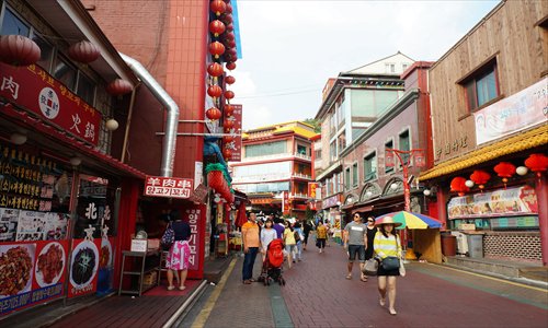 Tourists walk through a street with many Chinese restaurants in Chinatown, Incheon, South Korea on August 25. Photo: Park Gayoung/GT