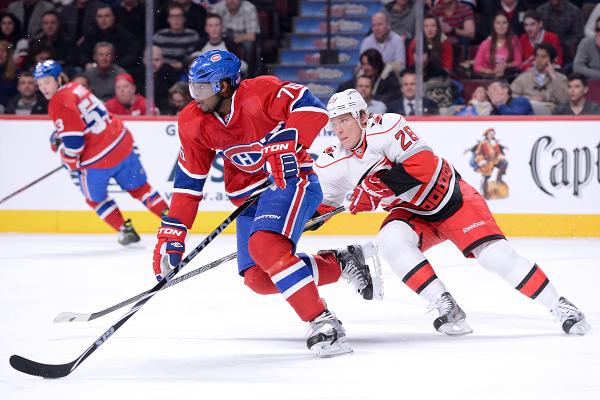 P.K. Subban (center) of the Montreal Canadiens is chased by Alexander Semin (right) of the Carolina Hurricanes on Monday. Photo: IC