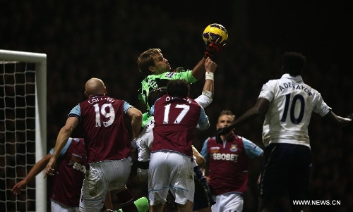 Jussi Jaaskelainen (above), goalie of West Ham United saves during the Barclays Premier League match between West Ham United and Tottenham Hotspur at the Boleyn Ground, Upton Park, in London, Britain on February 25, 2013. Tottenham Hotspur won 3-2 and lift into third in the table. (Xinhua/Wang Lili)  
