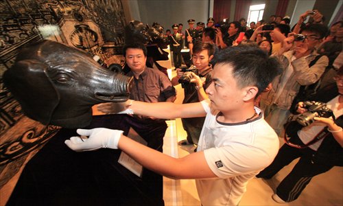 The bronze zodiac pig head was on display in Tianjin in 2011 after it returned to China in 2003 from an American collector. Photo: CFP 