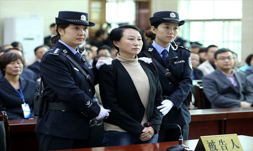 Gong Aiai, a former bank executive in Shenmu county, Shaanxi Province, stands trial at the Jingbian County People's Court on Tuesday. Photo: CFP