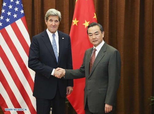 Chinese Foreign Minister Wang Yi (R) shakes hands with U.S. Secretary of State John Kerry in Beijing, capital of China, April 13, 2013. (Xinhua/Ding Lin)