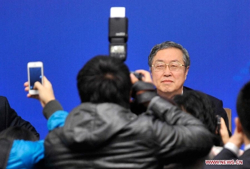 Zhou Xiaochuan, China's central bank governor, attends a news conference on China's currency policy and financial reform held by the first session of the 12th National People's Congress (NPC) in Beijing, capital of China, March 13, 2013. (Xinhua/Wang Peng) 