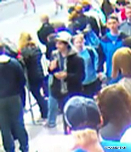 Photo released by the U.S. Federal Bureau of Investigation (FBI) in Boston on April 18, 2013 shows one (C) of the two Boston bombing suspects. The FBI special agent Richard DesLauriers on Thursday released the photos and video of two suspects of Monday's deadly bombings in Boston, asking for the public's help to identify them. (Xinhua/FBI)