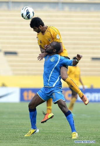  Khalid al Qatani (Up) of Kuwait's Qadsia SC vies with Kesse Jean of Jordan's Ramtha SC during the AFC CUP 2013 Football match in Kuwait City, Kuwait, on April 30, 2013. The match ended in a draw 2-2. (Xinhua/Noufal Ibrahim) 