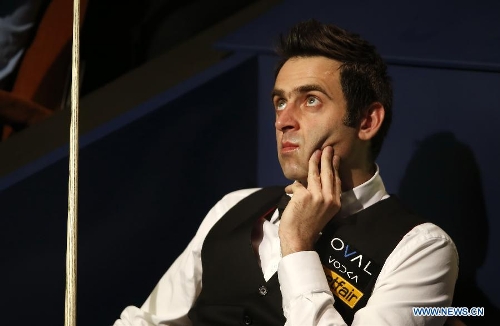 Ronnie O'Sullivan of England reacts during the final of 2013 World Snooker Championship at the Crucible Theatre in Sheffield, Britain, May 6, 2013. Ronnie O'Sullivan seals his fifth world title by defeating Barry Hawkins of England with 18-12 in the final.(Xinhua/Wang Lili) 