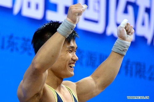  Lv Xiaojun celebrates winning the men's 77kg category snatch competition with 171kg at the National Weightlifting Championship in Zibo, east China's Shandong Province, March 25, 2013. (Xinhua/Guo Xulei) 