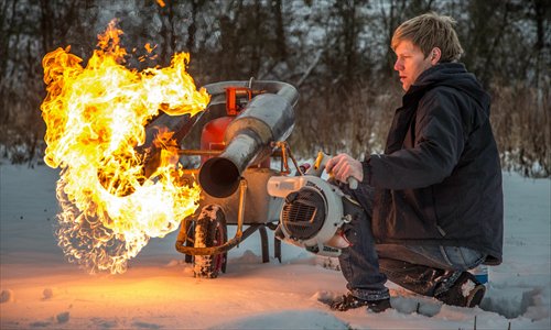 A plumber demonstrates an extreme way to defrost a driveway, using a gas-powered snow blower. Colin Furze, 33, spent three days designing and making the machine, which can clear fresh snow from a driveway in just 40 seconds. Photo: IC