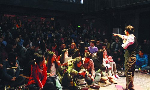 Lin Shen, one of the founders of TEDxBFSU, speaks as the host at their TEDx event on November 16 in Beijing. Photo: Courtesy of Wang Xianya
