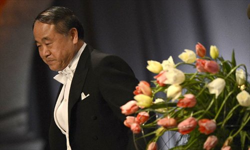 Chinese writer and Nobel Prize in Literature winner Mo Yan leaves the stage after his acceptance speech during the evening reception after Mo received Nobel Prize in Literature from Sweden's King Carl XVI Gustaf at the 2012 Nobel Prize ceremony in Stockholm, Sweden, December 10, 2012. Photo: Xinhua