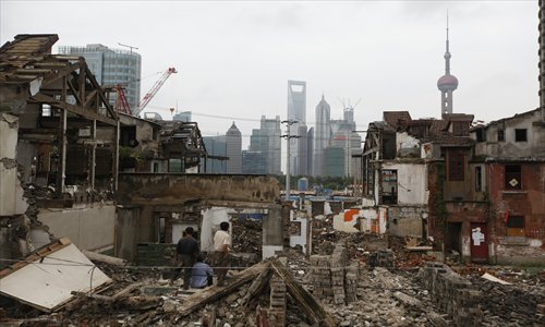 Buildings along the Huangpu River in Hongkou district are being torn down to make space for the local authorities' plans for the North Bund area. Photo: Cai Xianmin/GT 