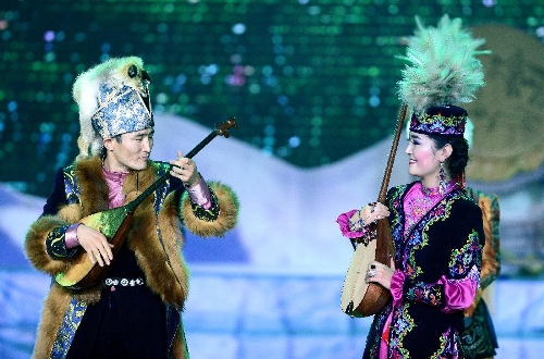 Actors perform in stage play Snowland Families in Altay, northwest China's Xinjiang Uygur Autonomous Region, Jan. 29, 2013. The stage play, created and performed by Altay Art Troupe, tells stories along the ancient Silk Road. (Xinhua/Sadat) 