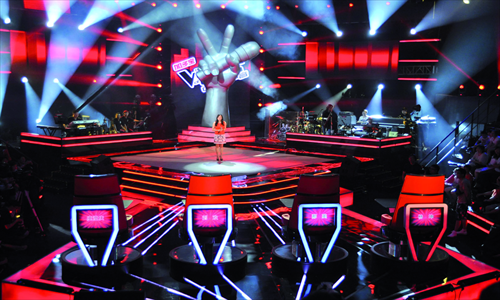 A contestant performs on the stage for The Voice of China in July 2012. Photo: CFP