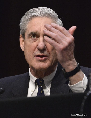 CIA Director John Brennan testifies before the Senate Select Intelligence Committee during a hearing on 