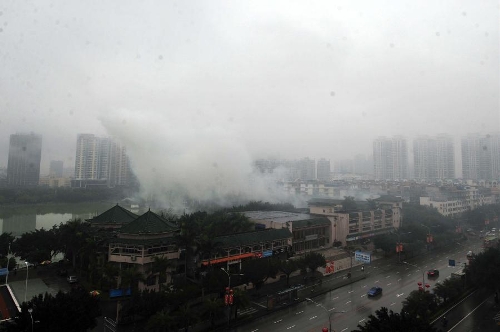 The city is seen through the fog in Nanning, capital of south China's Guangxi Zhuang Autonomous Region, Feb. 17, 2013. Heavy fog engulfed Nanning here on Sunday. (Xinhua/Huang Xiaobang) 
