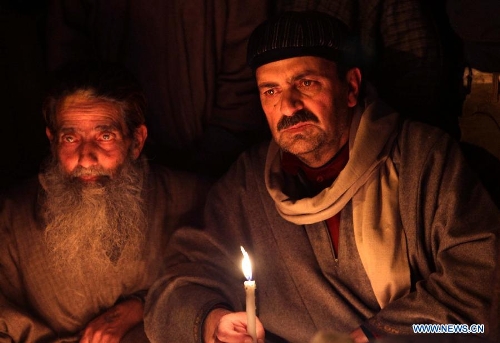 Activists of pro-independent group Jammu and Kashmir Liberation Front (JKLF) stage a torch and candle light protest in Srinagar, summer capital of Indian-controlled Kashmir, Feb. 2, 2013. Dozens of JKLF activists protest the life term sentences granted to Kashmiri separatist activists by Indian courts. JKLF under its chairmanship initiated the campaign urging Indian authorities to revoke the decisions and release the arrested. (Xinhua/Javed Dar) 