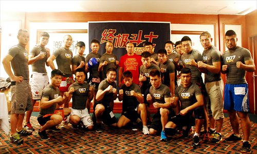 Main: Zhang Tiequan (center of back row) poses with Chinese fighters at TUF tryouts in Beijing on July 21. Photo: UFC 