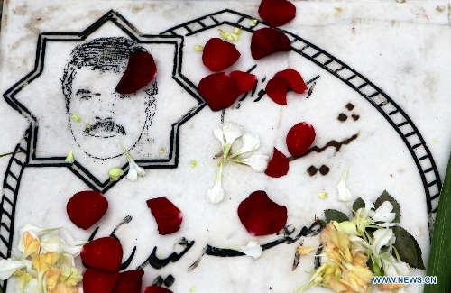 A grave of a soldier who was killed during the 1980-88 Iran-Iraq war, is seen at the Behesht-e Reza cemetery in Mashhad city, northeastern Iran, March 25, 2013. Iranians visited the cemetery to commemorate soldiers who were killed during the Iran-Iraq war, during the Iranian New Year holidays. (Xinhua/Ahmad Halabisaz) 