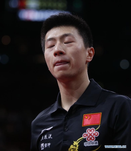 Ma Long of China reacts during the semifinal of men's singles against his teammate Wang Hao at the 2013 World Table Tennis Championships in Paris, France on May 19, 2013. Ma lost 2-4. (Xinhua/Wang Lili) 