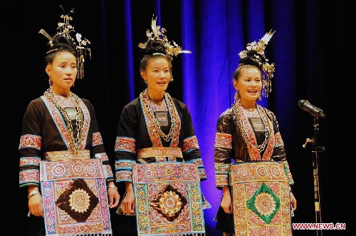 Folk artists from China's southwestern Guizhou province perform ethnic Dong's Ka Lau chorus, the big song of their distinguished folk vocal art that has ranked in the UNESCO's intangible cultural heritage list, in Houston, the United States, on June 27, 2013. (Xinhua/Wang Hongbin)  